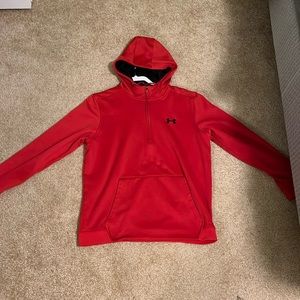 Red Under Armour fleece sweater.